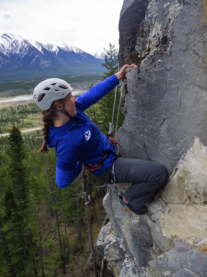 Climber chalks up on a jug.