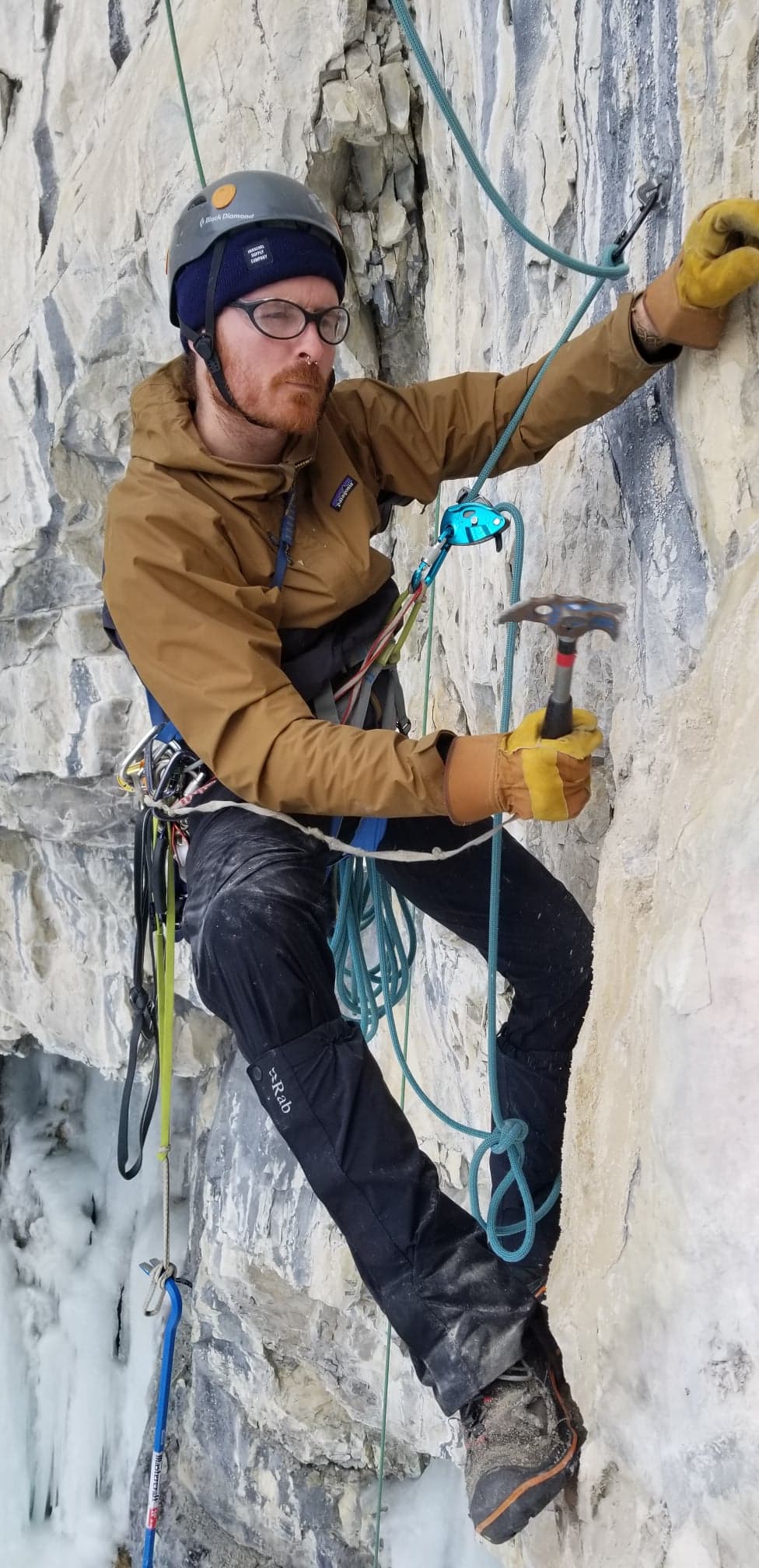 A route developer prepares a climbing route.